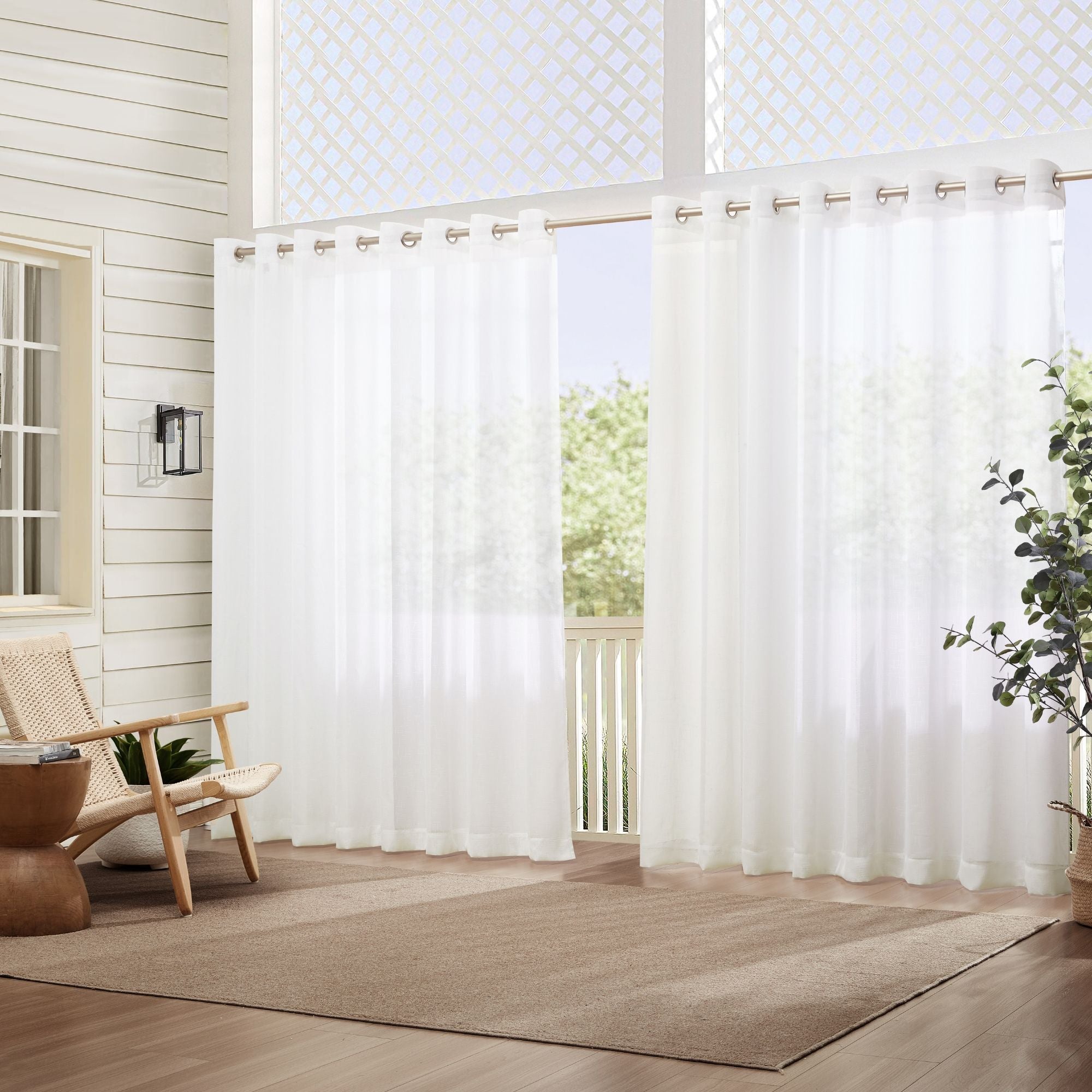 photo of an outdoor patio with sheer white curtains