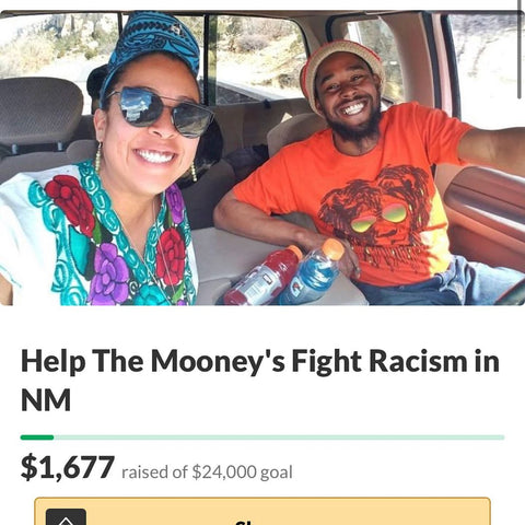 Man and woman driving in a car with title "Help the Mooney's Fight Racism in New Mexico"