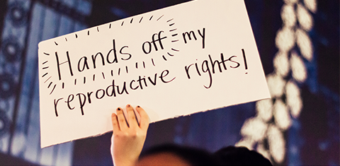 A sign that says “hands off my reproductive rights!”