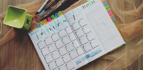 A planner opened on the January calendar page