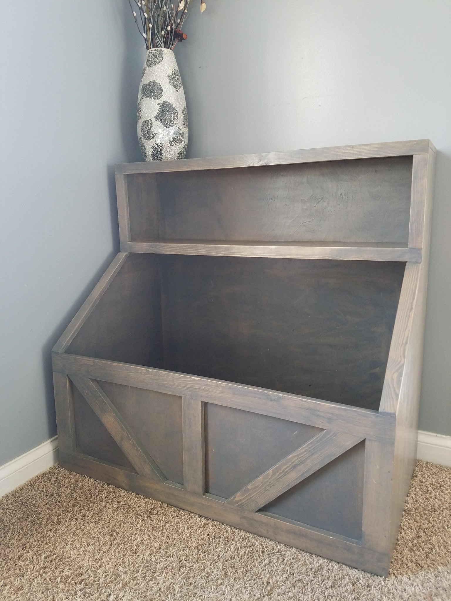 wooden toy shelf with bins