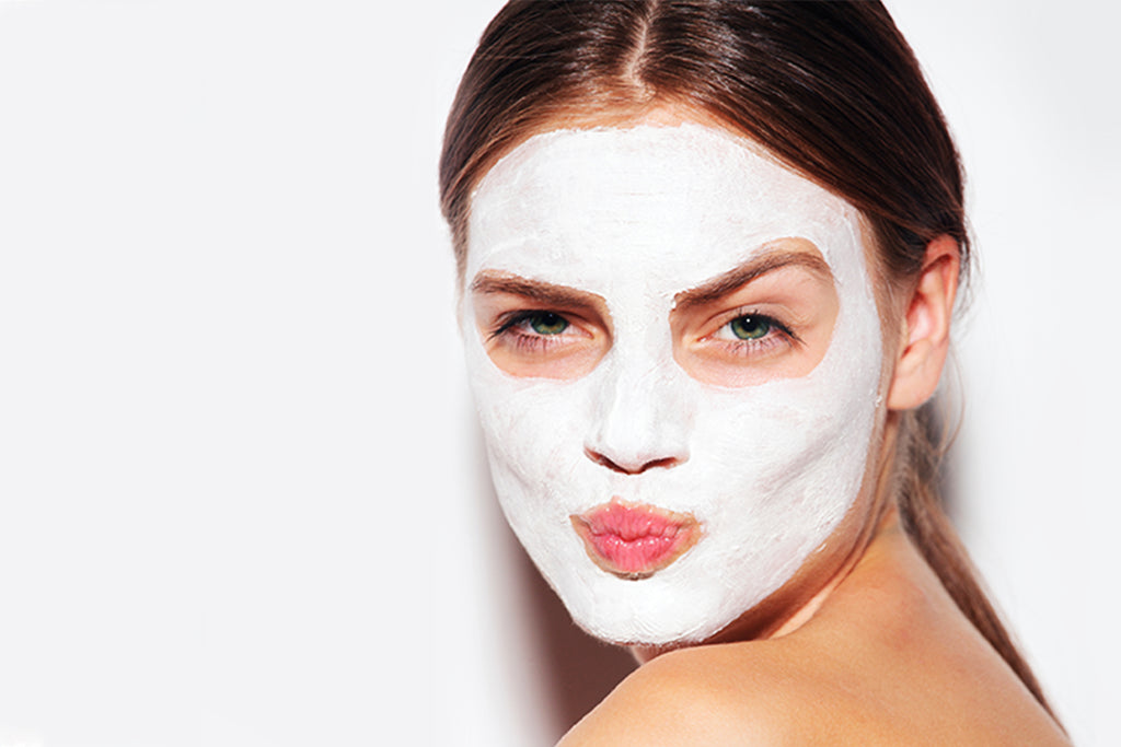 Woman with white kaolin clay face mask