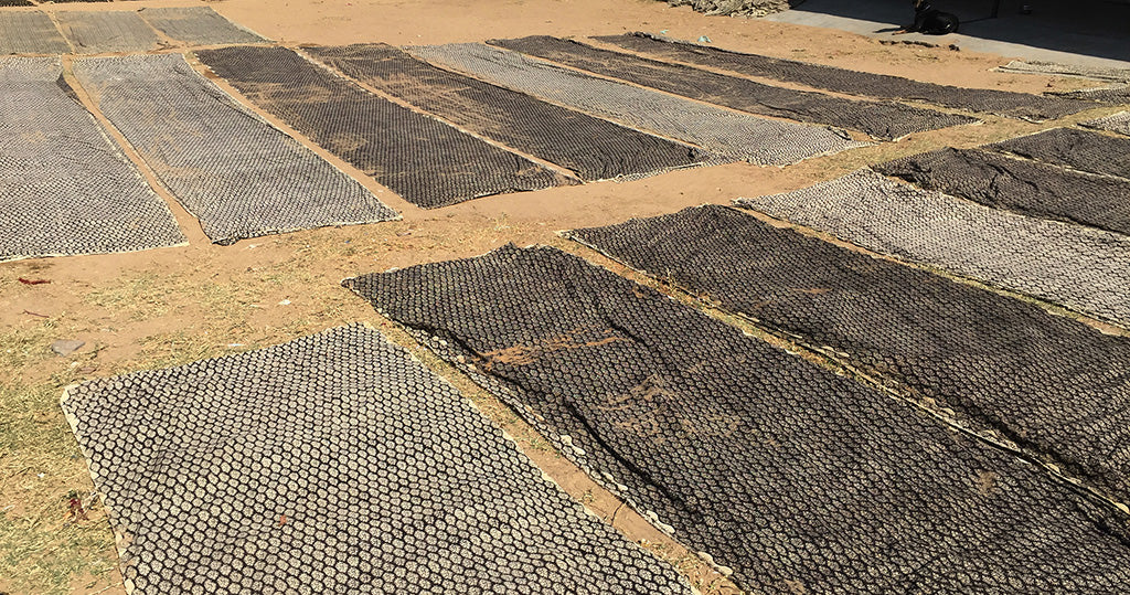 block printing drying on ground - pallu design
