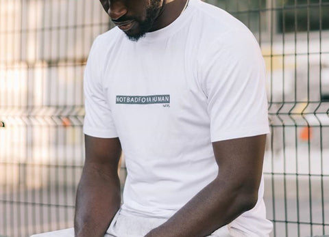 Ibrahim Appiah Wearing the Navas Lab Apparel Tall Tees in White