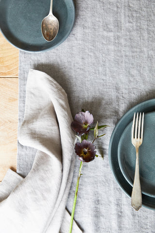 Linen napkin and grey stoneware plates 