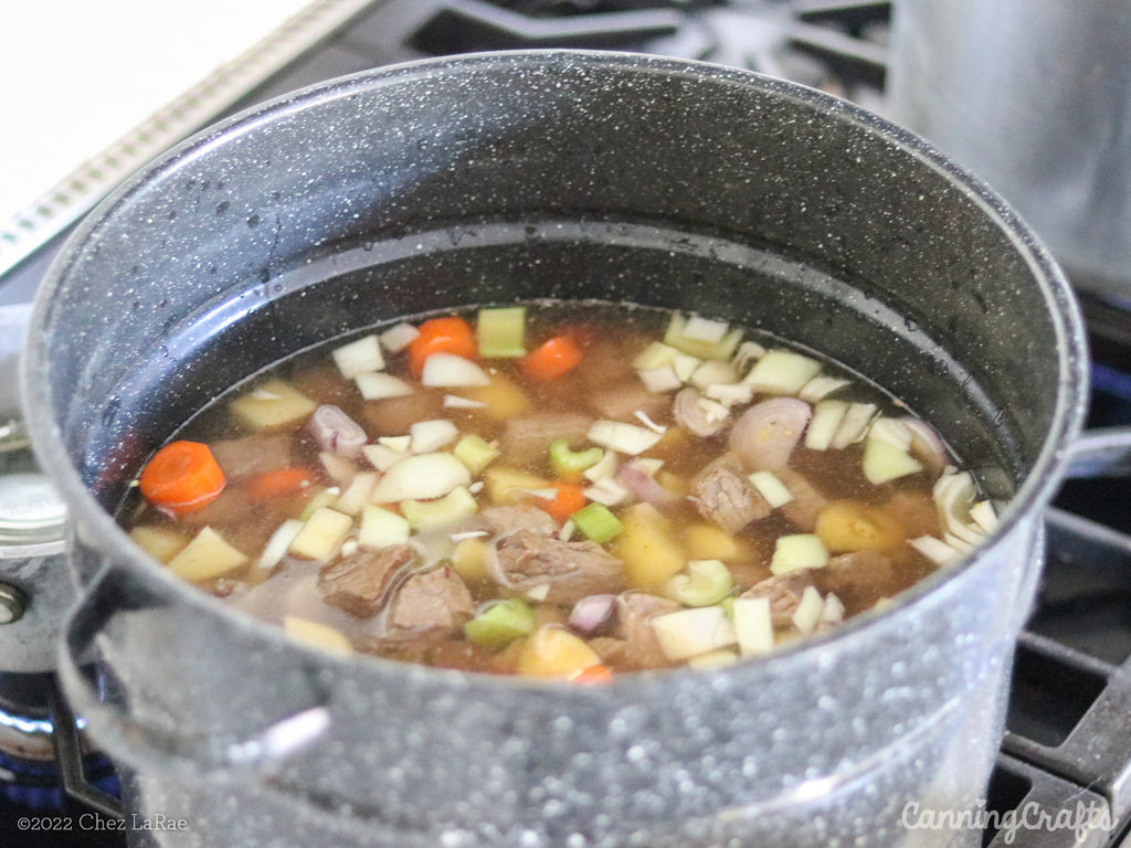 Filled Dutch Oven for Beef Stew with Vegetables Pressure Canning Recipe | CanningCrafts.com