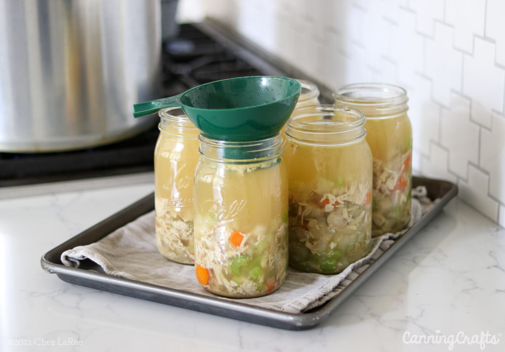 Filling Quart Jars for Chicken Soup Pressure Canning Recipe | CanningCrafts.com