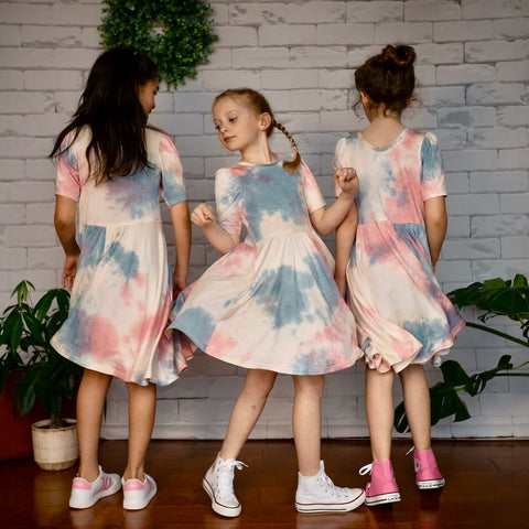 three girls twirling in tie-dye bamboo sustainable handmade soft jersey dress