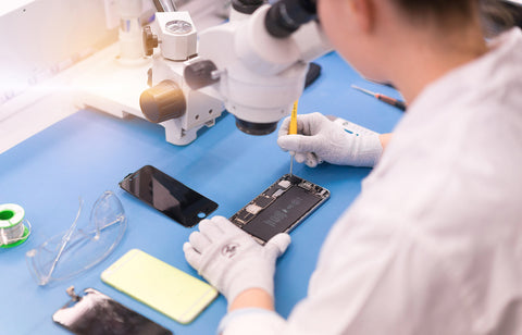 Technician performing an iphone repair