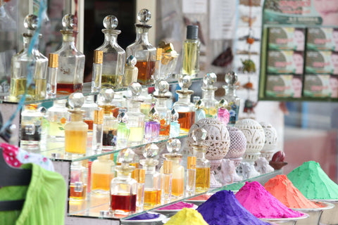 bottles of perfume organized on shelf