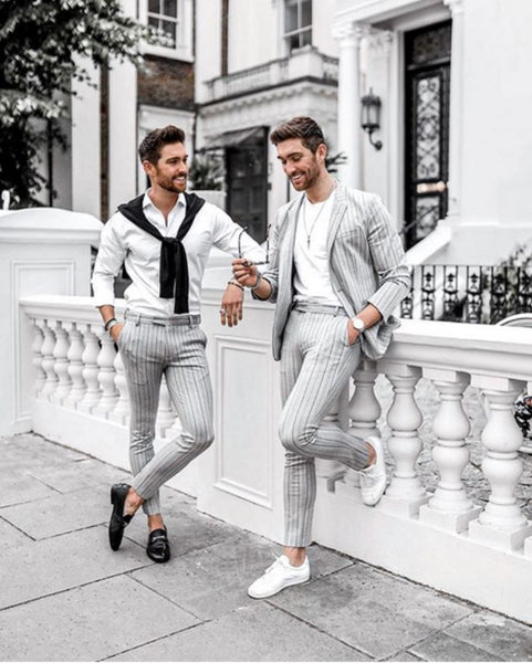 grey suit with white sneakers