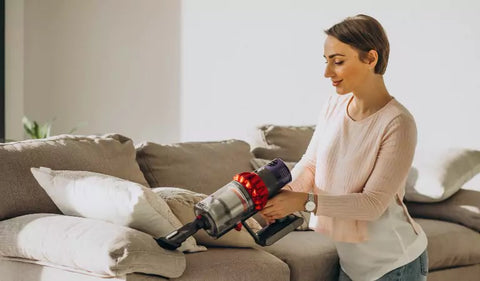 Vacuuming a sofa