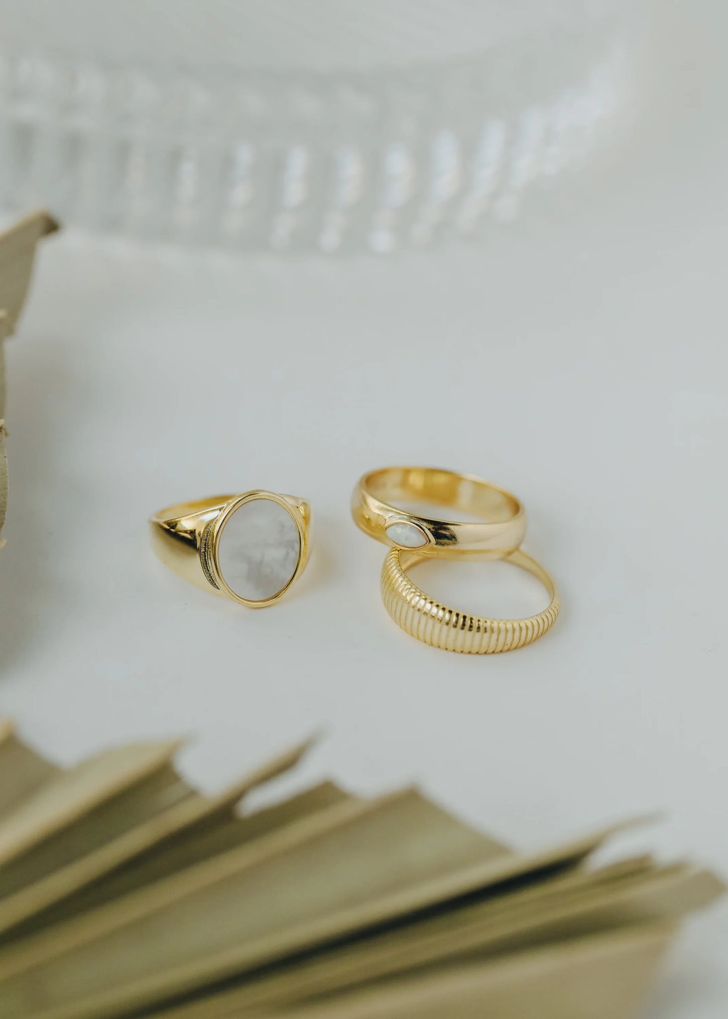 UNIKONCEPT Lifestyle Boutique and Lounge; Jax Kelly oval opal ring pictured with two other gold rings.