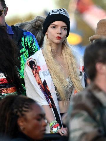 Anya Taylor-Joy rocked a beany and a bangin' white graphic tee on Day 5's Glasto escapades!