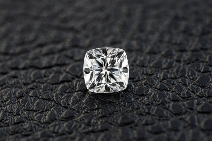 Cushion cut diamond on black background