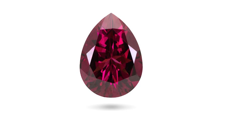 Pear-cut garnet isolated against a white background