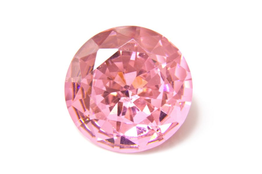 Pink diamond on a white background.