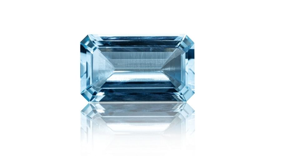 An aquamarine stone isolated against a white background