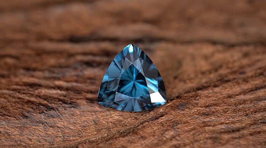 Blue spinel on wood