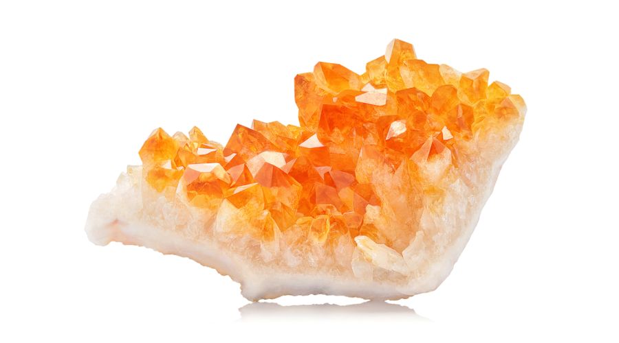 Raw citrine isolated against a white background