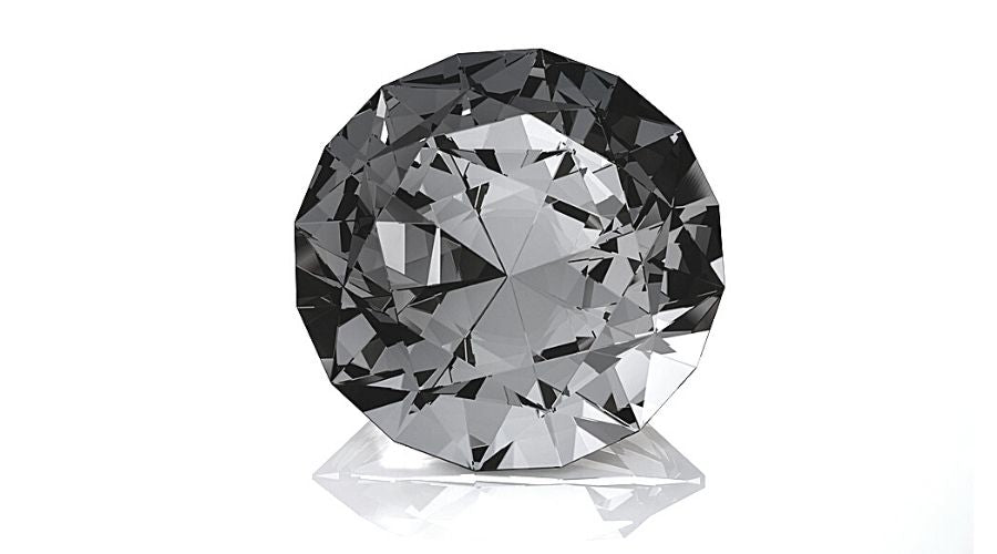 A faceted diamond isolated on a white background