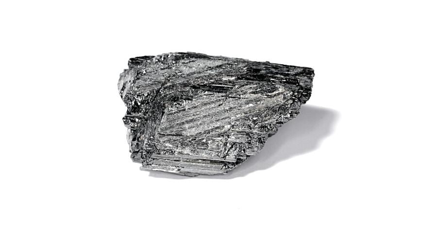 Gray tourmaline isolated against a white background