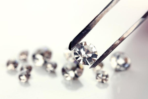 isolated diamond on a tweezer