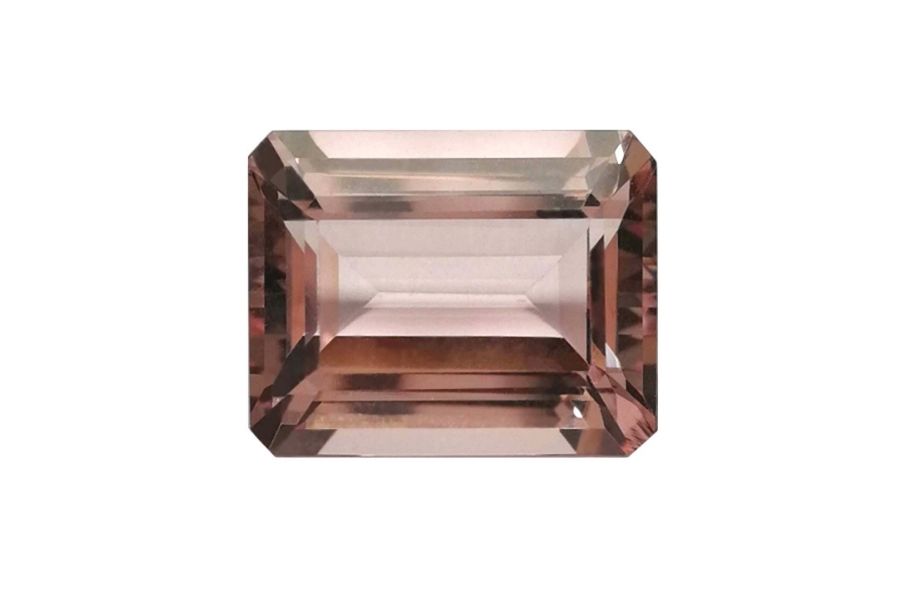 Faceted morganite on a white background.
