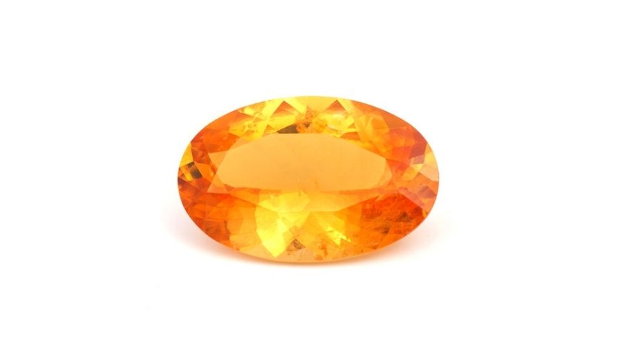 An orange sapphire isolated against a white background