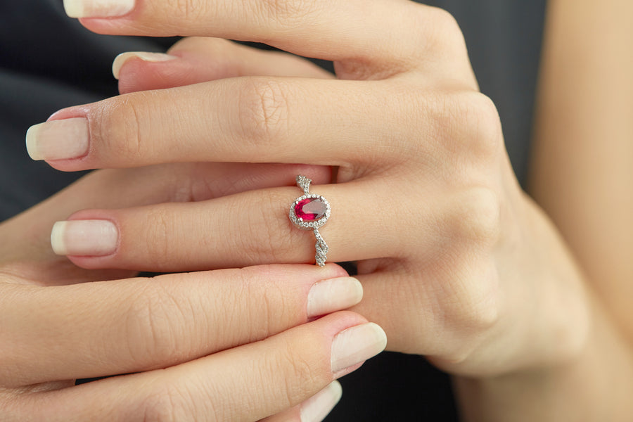 A model wearing a ruby and diamond ring.