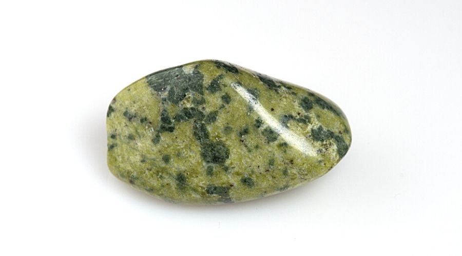Serpentine stone isolated against a white background