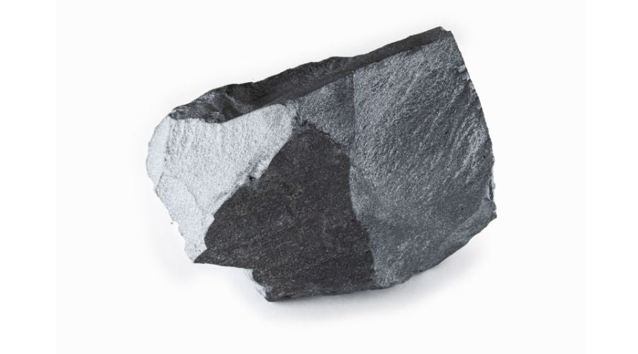 A gray hematite stone isolated against a white background