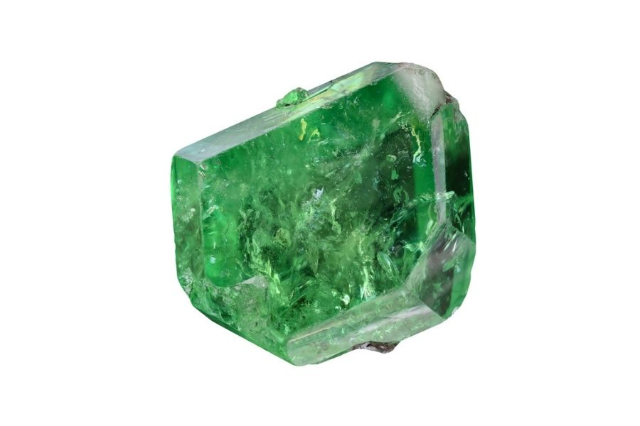 Tsavorite garnet on a white background