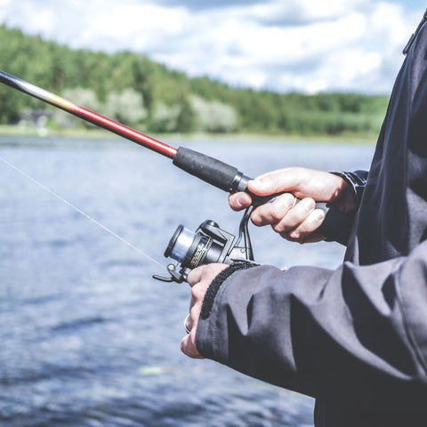 a person holding a fishing rod