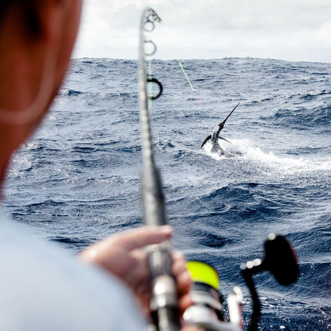 man fishing on boat