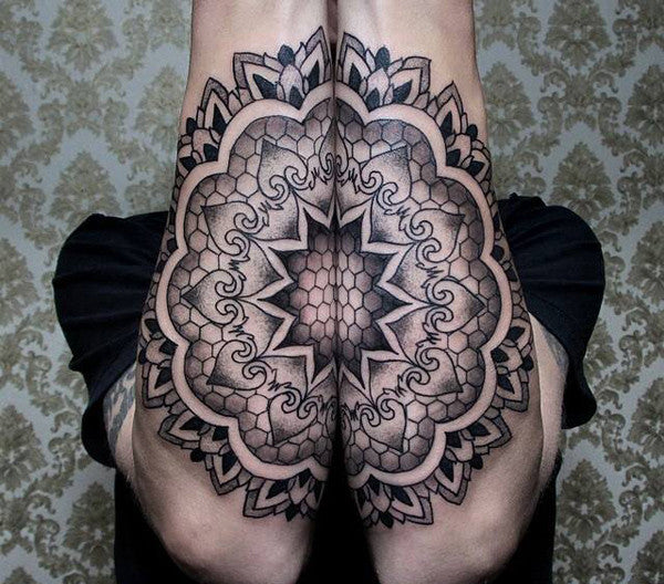 Ornamental style mandala tattoo on the left thigh
