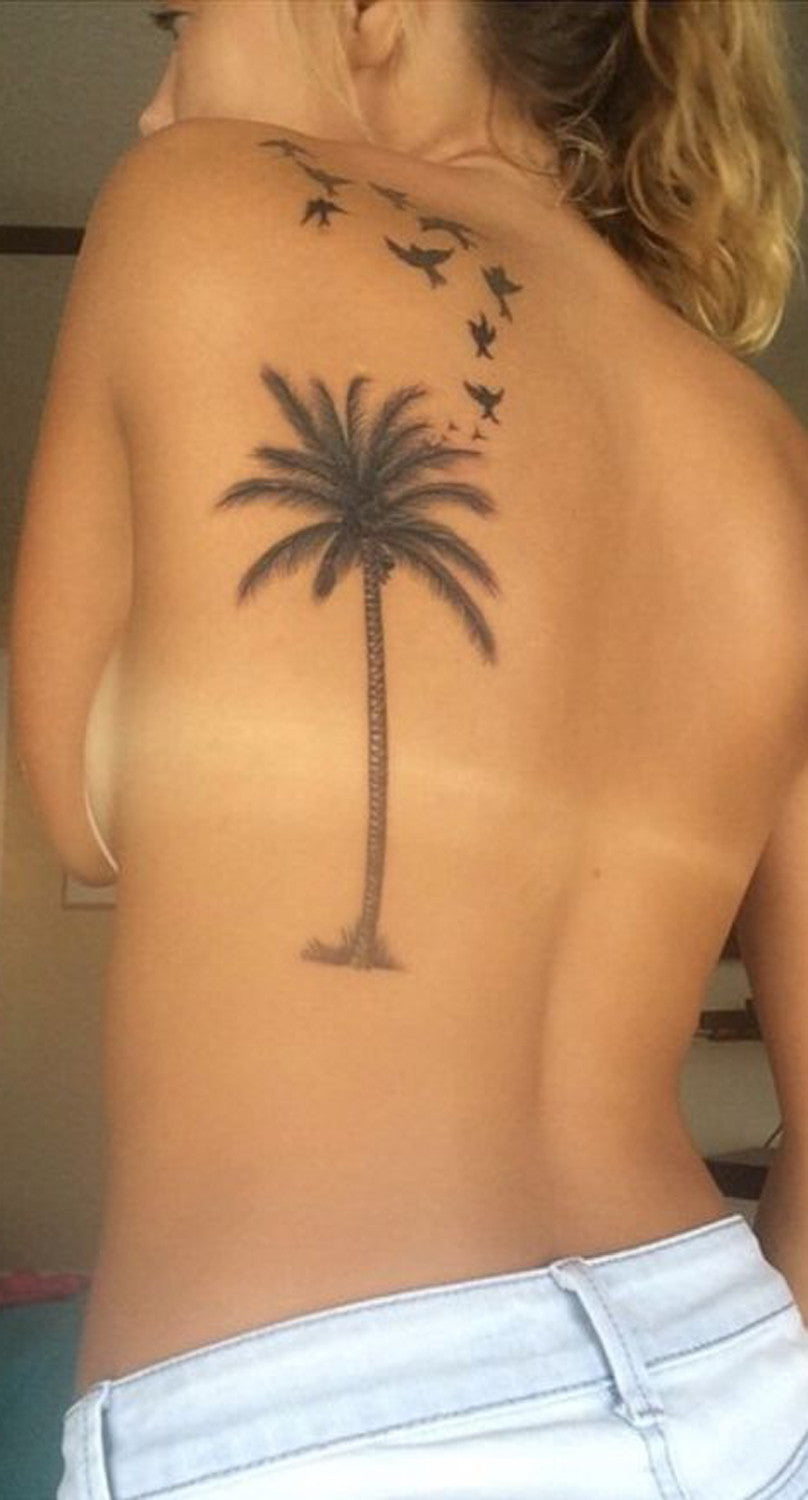 Palm Tree Back Sparrow Tattoo Ideas for Women at MyBodiArt.com