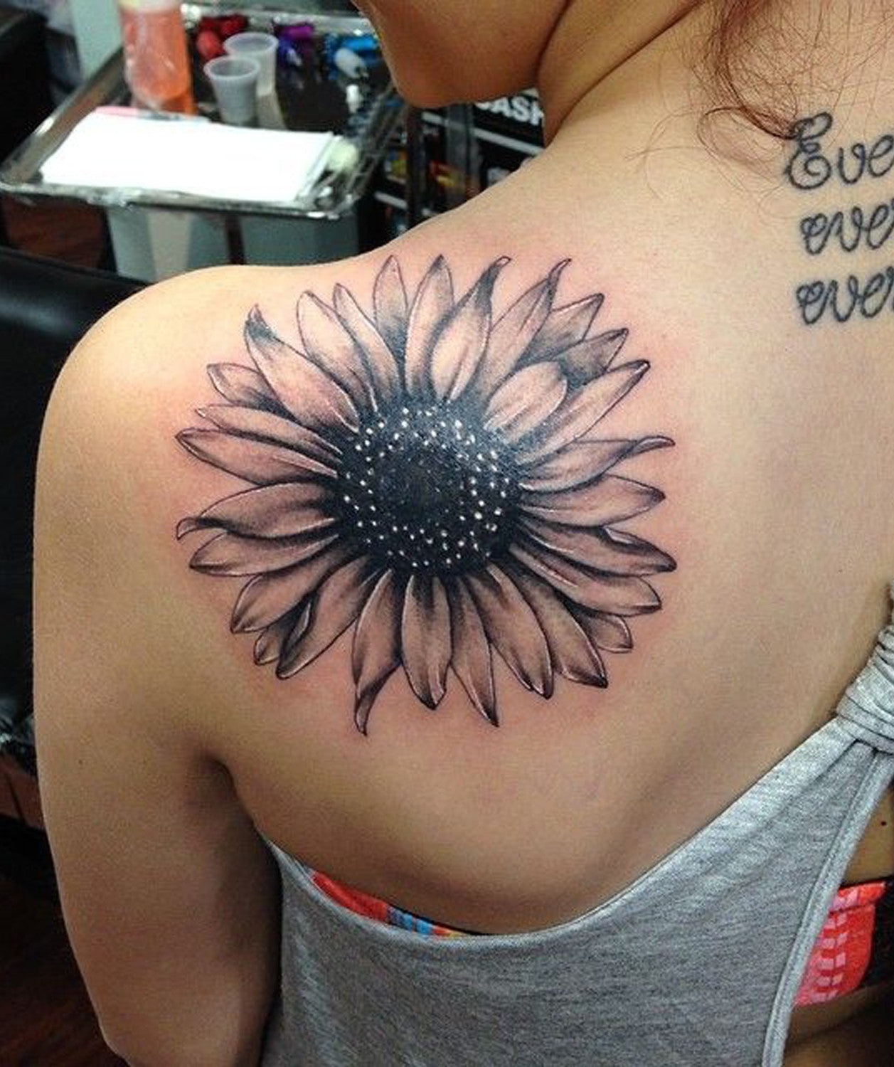 This sunflower tattoo design has a bee hovering nearby. Both are symbols of  life and fertility | Ratta Tattoo