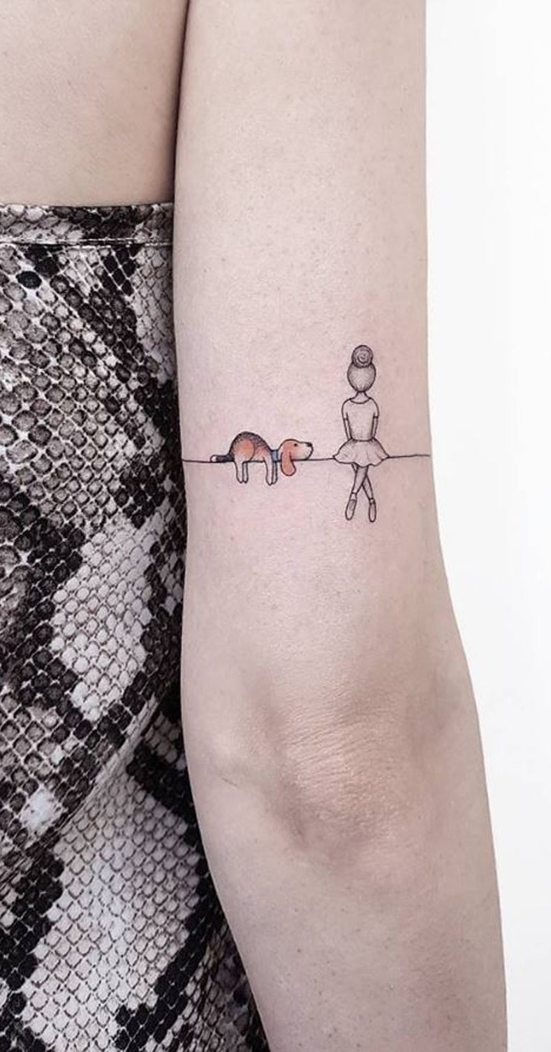 Tattoo of her dogs ears located on the inner forearm