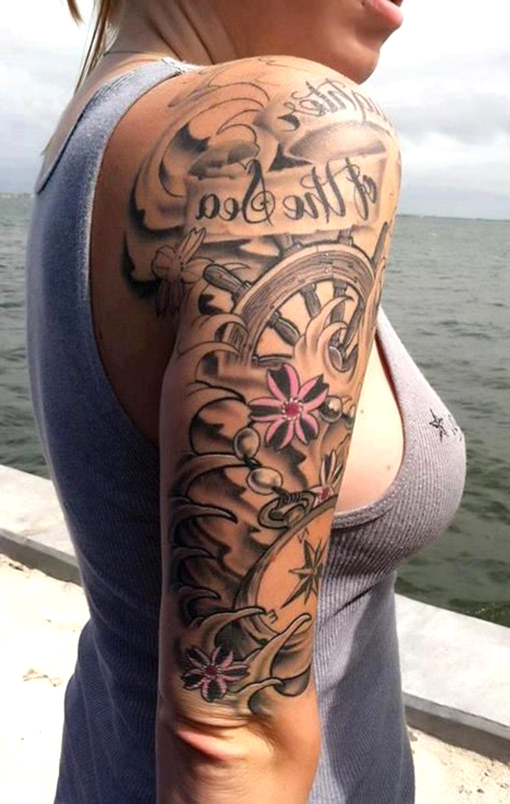 Black Full Arm Sleeve Tattoo Ideas for Women - Sea Flower Rudder Bicep Tat -  ideas de tatuaje manga negro brazo para mujeres -  www.MyBodiaArt.com