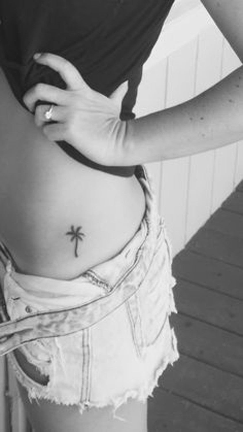 Small Hip Tattoos Ideas for Women - Black Palm Tree Design Femme at MyBodiArt.com