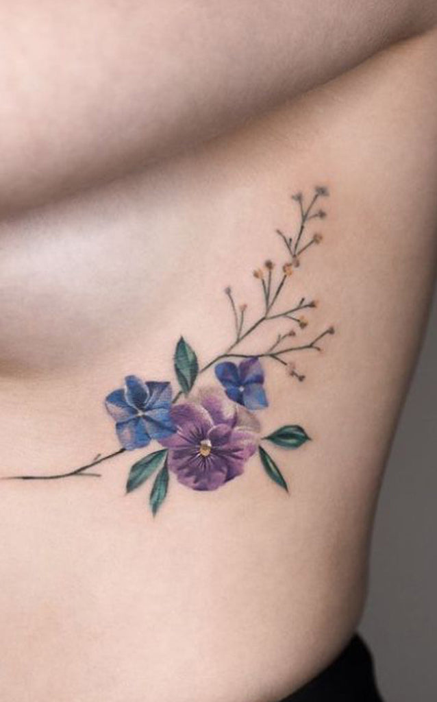 Watercolor Blue Purple Wreath Floral Flower Rib Tattoo Ideas for Women - www.MyBodiArt.com