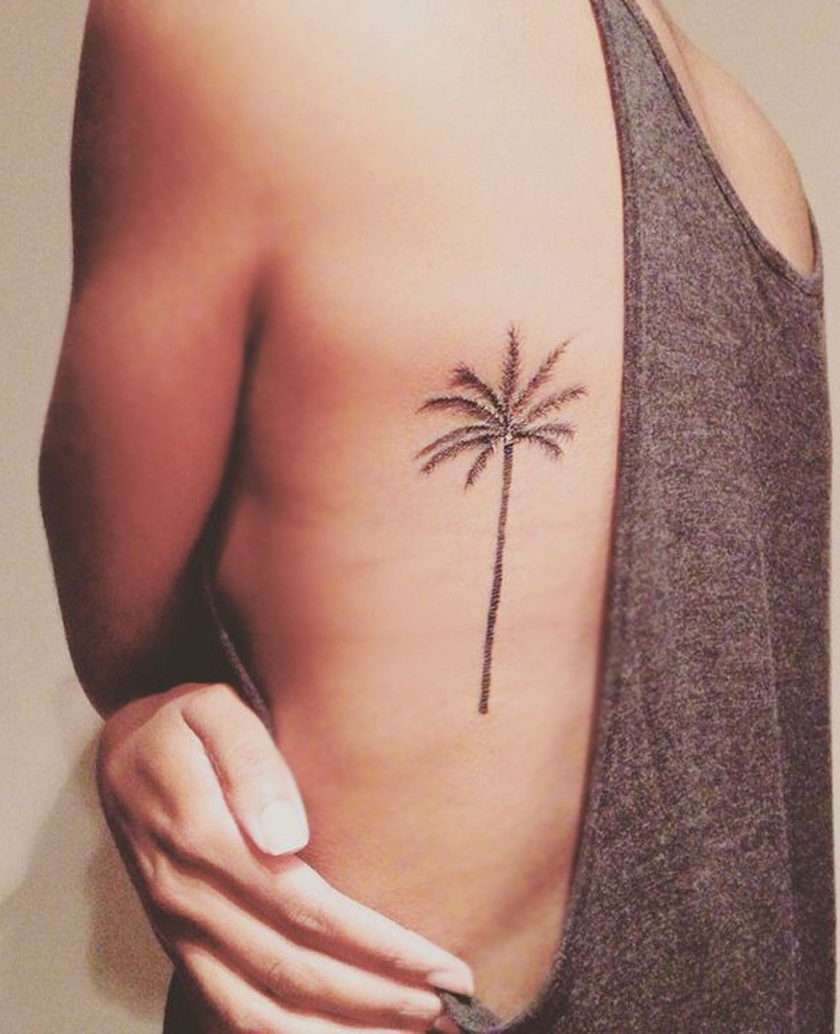 Beautiful Vertical Black Palm Tree Back Womens Tattoo at MyBodiArt.com