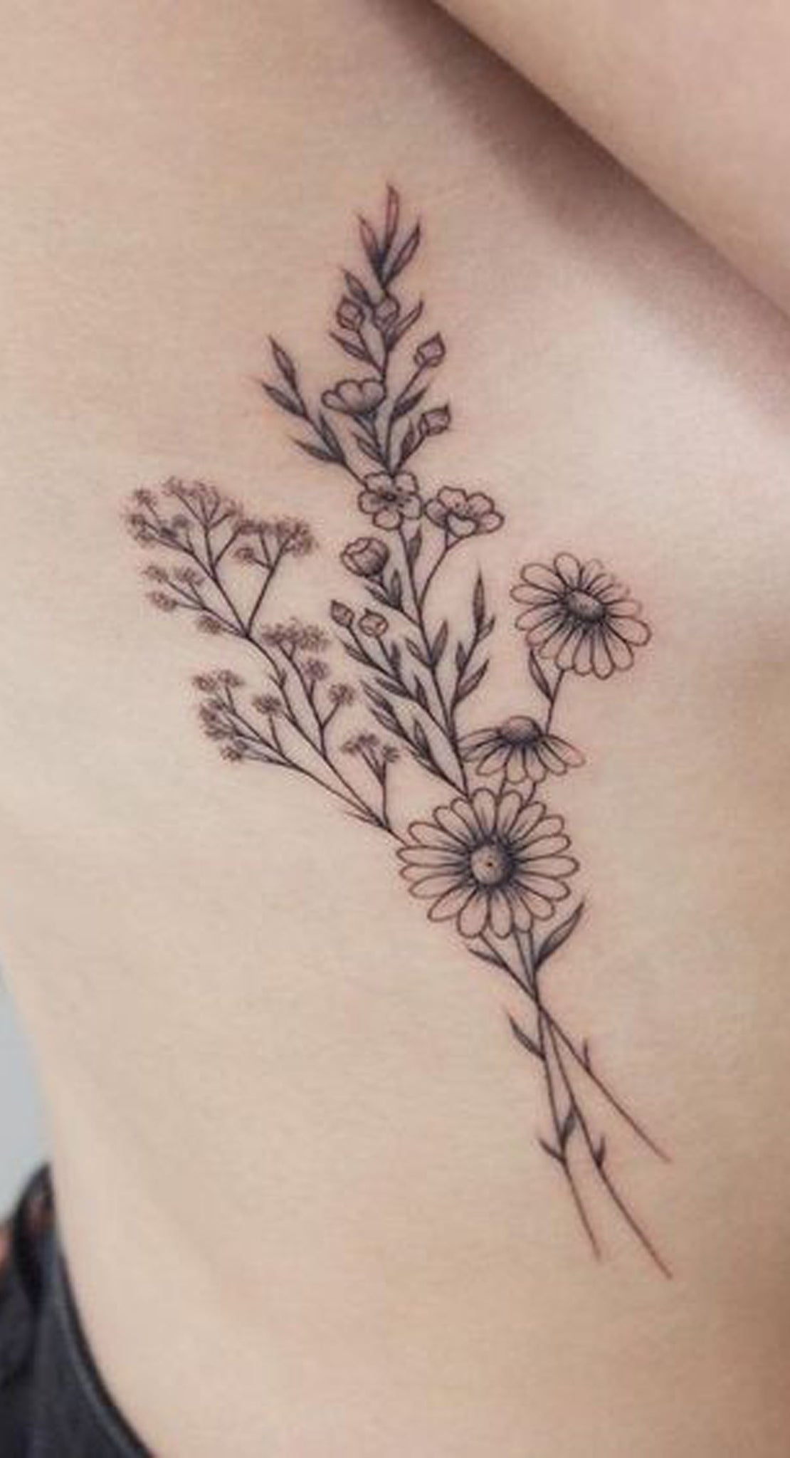 Wild Flower Sunflower Rib Tattoo Ideas for Women - Black and White Delicate Side Tat - www.MyBodiArt.com #tattoo