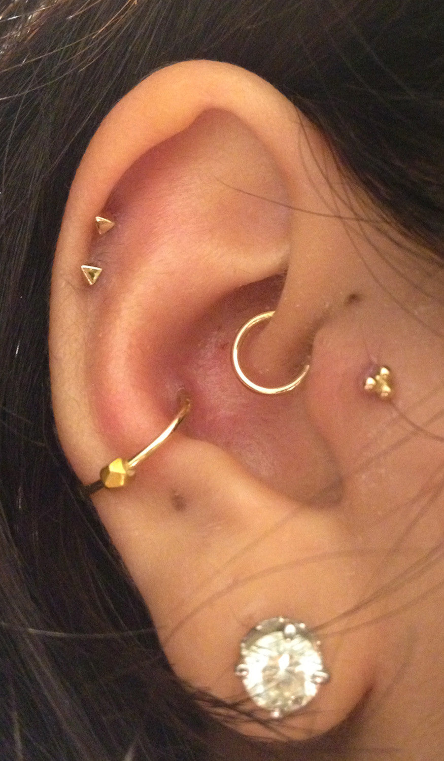 Ear Piercing Ideas - Conch Piercing Hoop - Tragus Piercing Jewelry - Cartilage Piercing at MyBodiArt.com