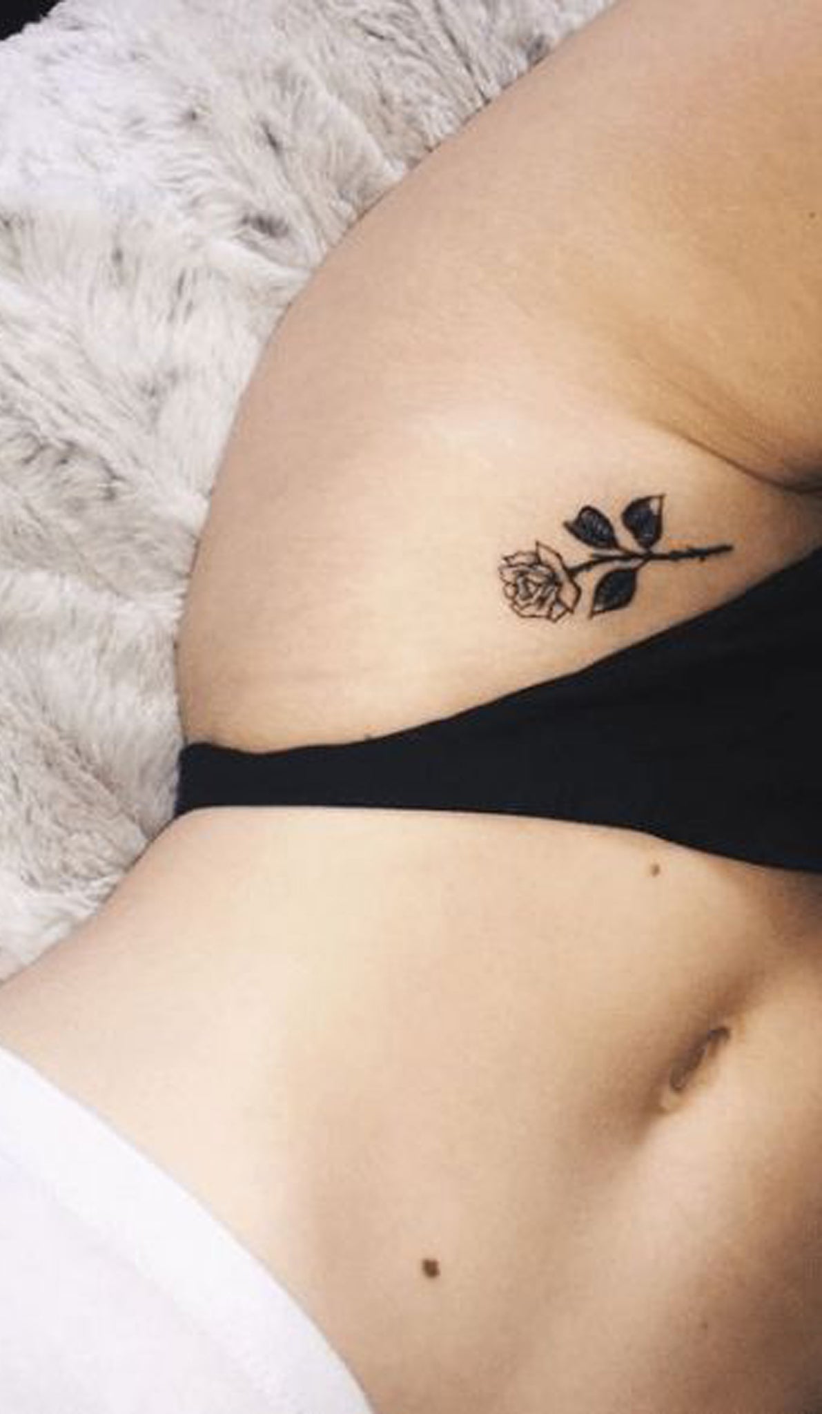 Tiny Small Rose Hip Tattoo Ideas for Women - Black Flower Outline Side Tat - www.MyBodiArt.com #tattoos