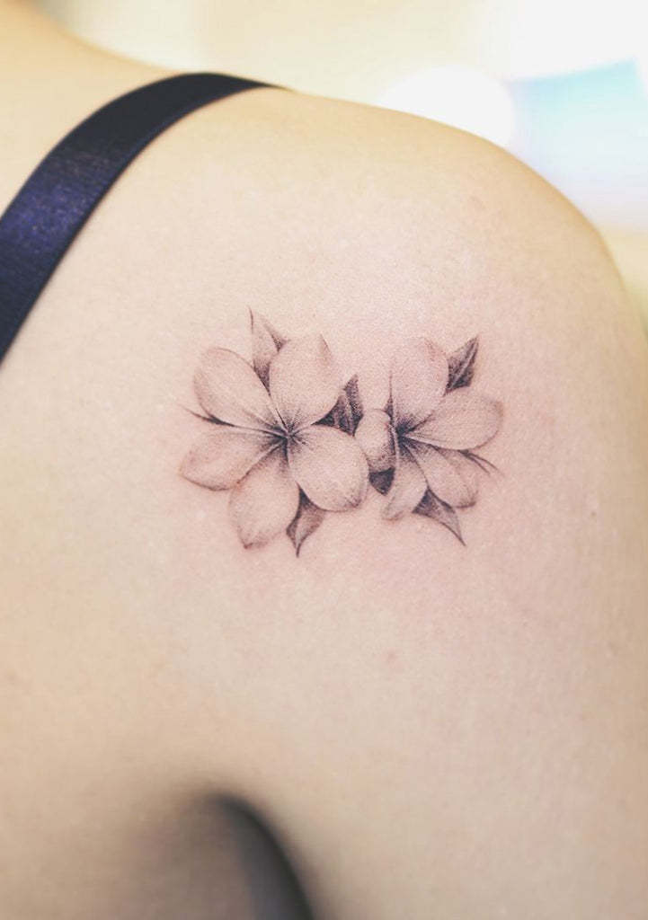 Beautiful White Floral Flower Plumeria Shoulder Back Tattoo Ideas for Women - www.MyBodiArt.com