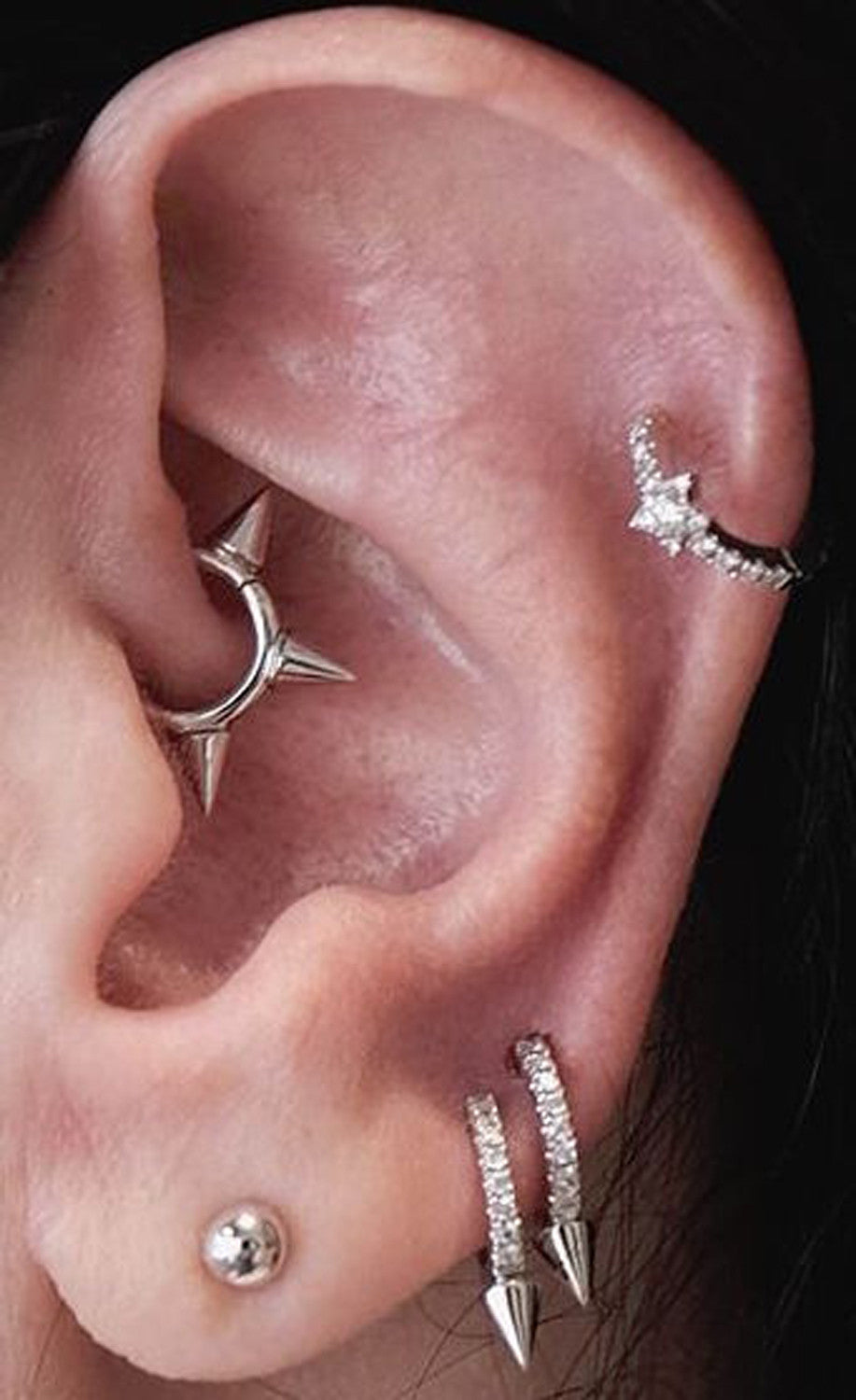 Cool Celebrity Ear Piercing Ideas at MyBodiArt.com - Spiky Rook Jewelry Daith Earrings Cartilage Hoop Silver Ear Lobe Studs