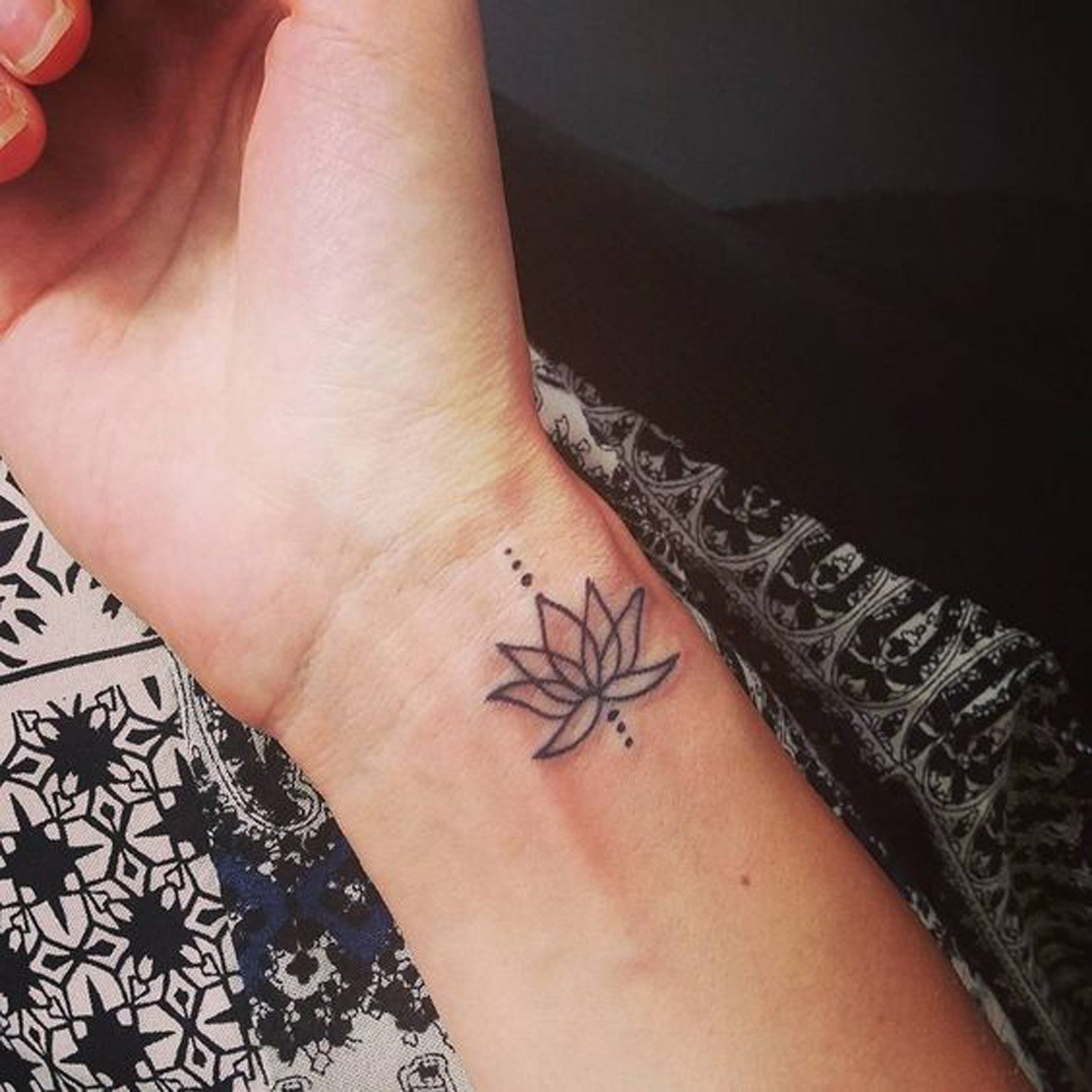 Small Lotus Mandala Flower Wrist Placement Tattoo Ideas for Women at MyBodiArt.com