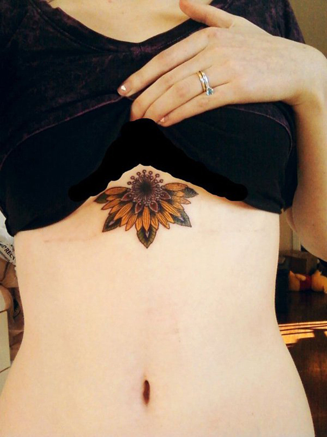 Colored Sunflower Sternum Underboob Flower Tattoo Idea for Women at MyBodiArt.com 
